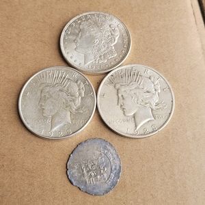 3 silver dollar coins and foreign silver